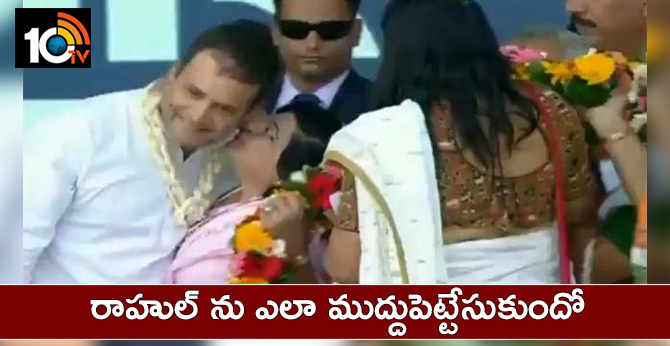 Woman kisses Rahul Gandhi on stage during Valsad rally