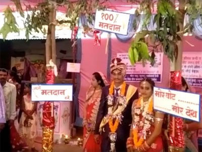 100%voting slogan at the wedding Celebrations