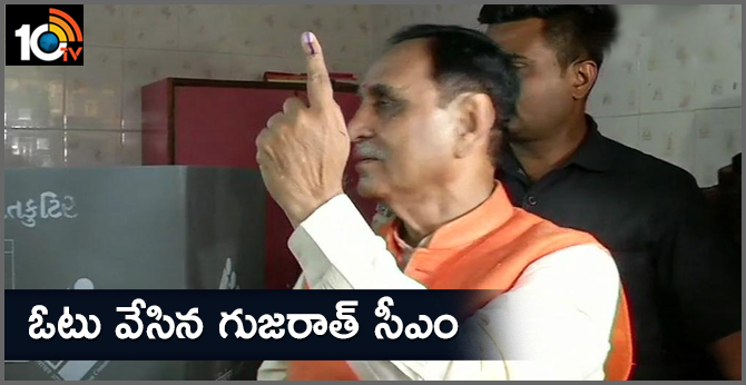 Gujarat CM cast vote at a polling booth in Anil Gyan Mandir school in Rajkot