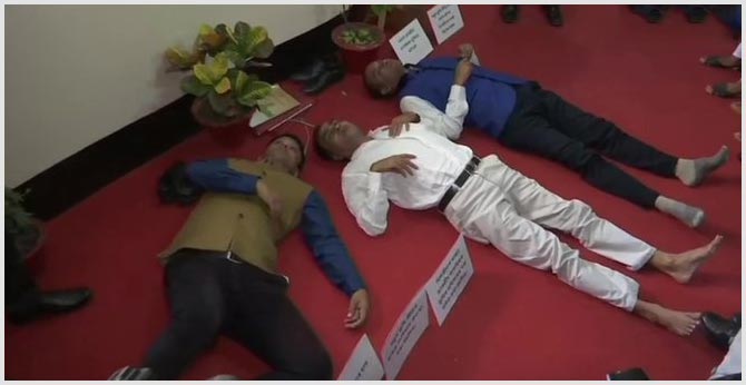 Assam MLA Sherman Ali Ahmed and 2 other MLAs lie down on the floor at state Legislative Assembly