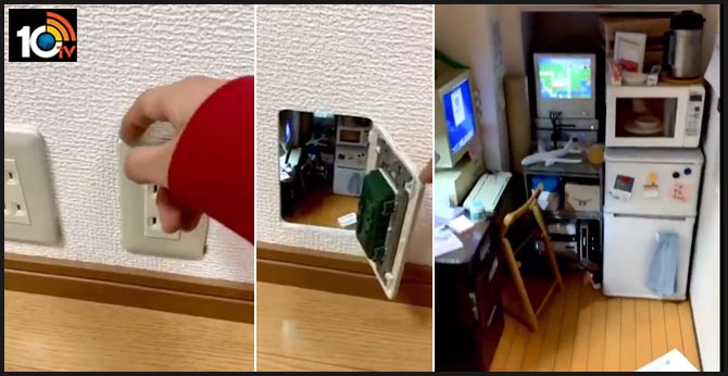 Complete with TV and computer, Japanese artist creates mini room inside power outlet