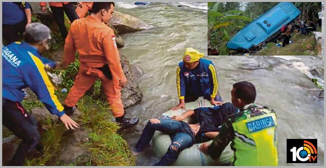 Indonesia bus crash: at least 24 dead after vehicle falls into ravine