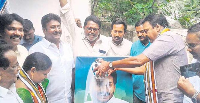 JANASENA MLA Rapaka Vara Prasada Rao Hats Milk on Jagan Photo