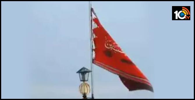 Iran unfurls symbolic red flag