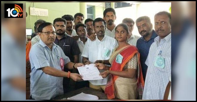 Transgender Riya receiving the certificate of victory from the Returning Officer in Tiruchengode