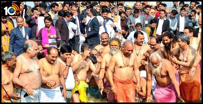 up cm yogi adityanathtakes holy dip ganga prayagraj
