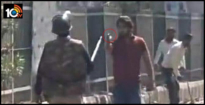 Viral video shows man with gun charging at policeman during in Delhi Clashes