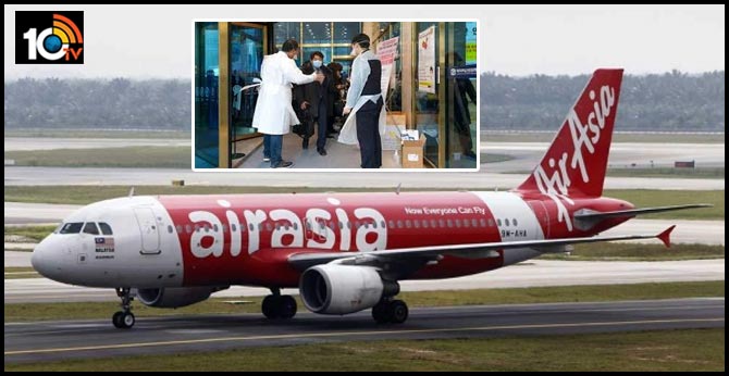 COVID-19 Fever Air Asia pilot exits via sliding window