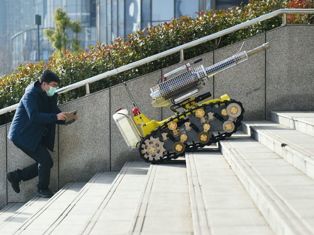 These robots are fighting the coronavirus in China by disinfecting hospitals, taking temperatures, and preparing meals