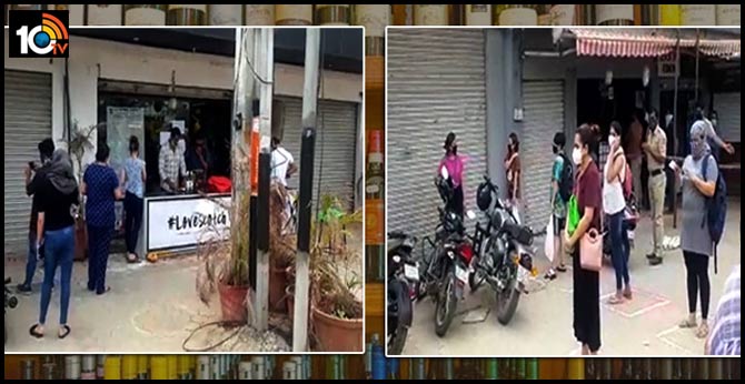 Women queuing in front of liquor stores