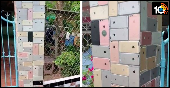 ultimate apple flex hundreds of iphone 6 phones  sed as decorative tiles for house fence