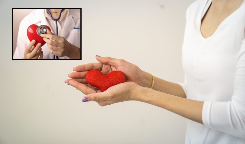 Asian Woman Holding A Red Heart In Her Hands.
