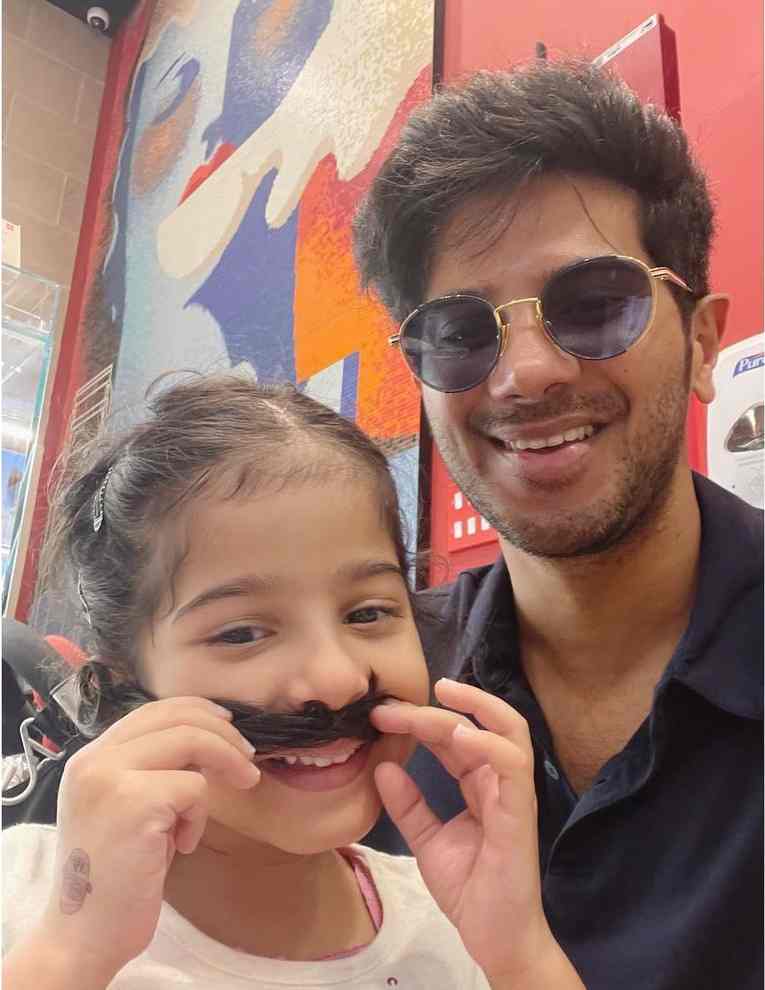 Dulquer Salmaan with his daughter