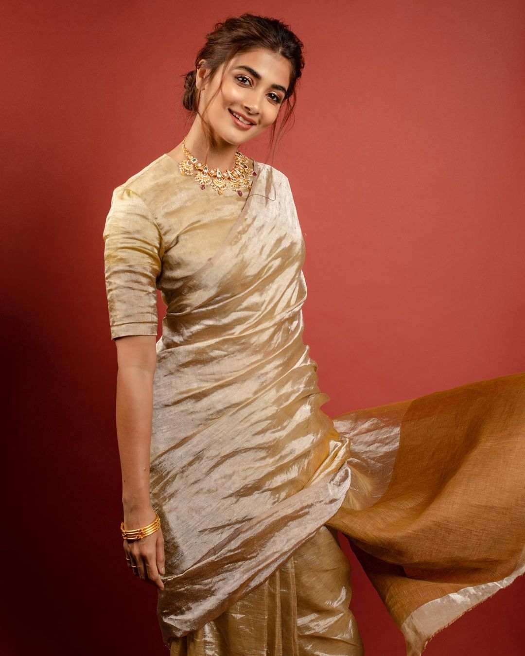 Pooja Hegde Shines In Golden Saree001
