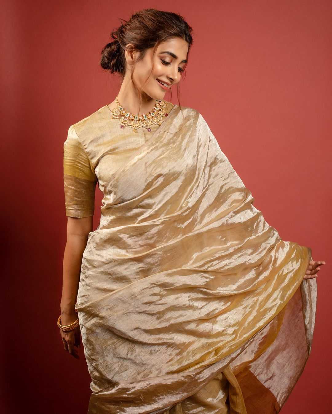 Pooja Hegde Shines In Golden Saree003