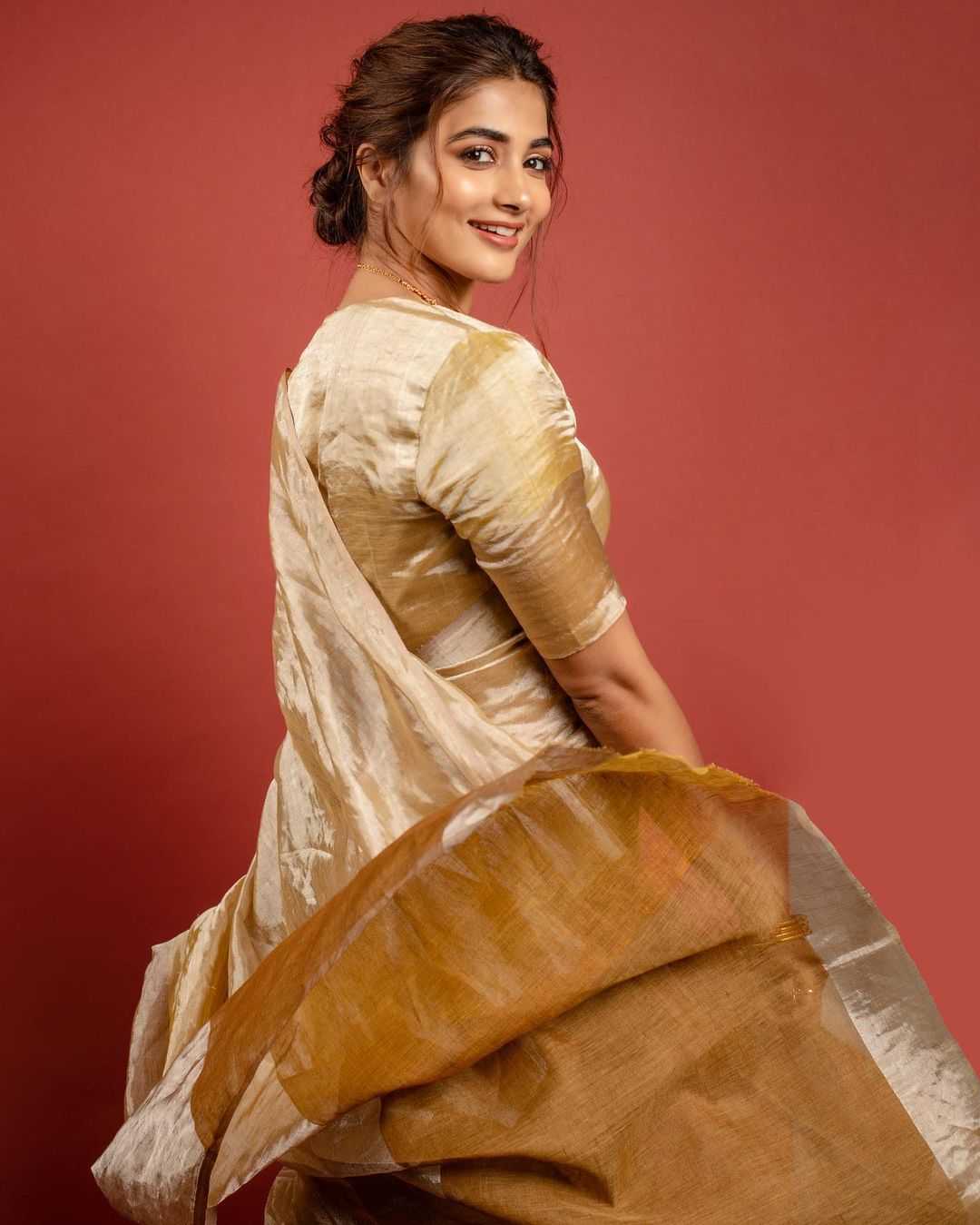 Pooja Hegde Shines In Golden Saree004