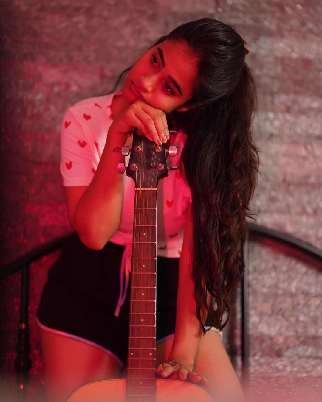 Deepthi Sunaina Latest Photoshoot in short Nikkar with Guitar