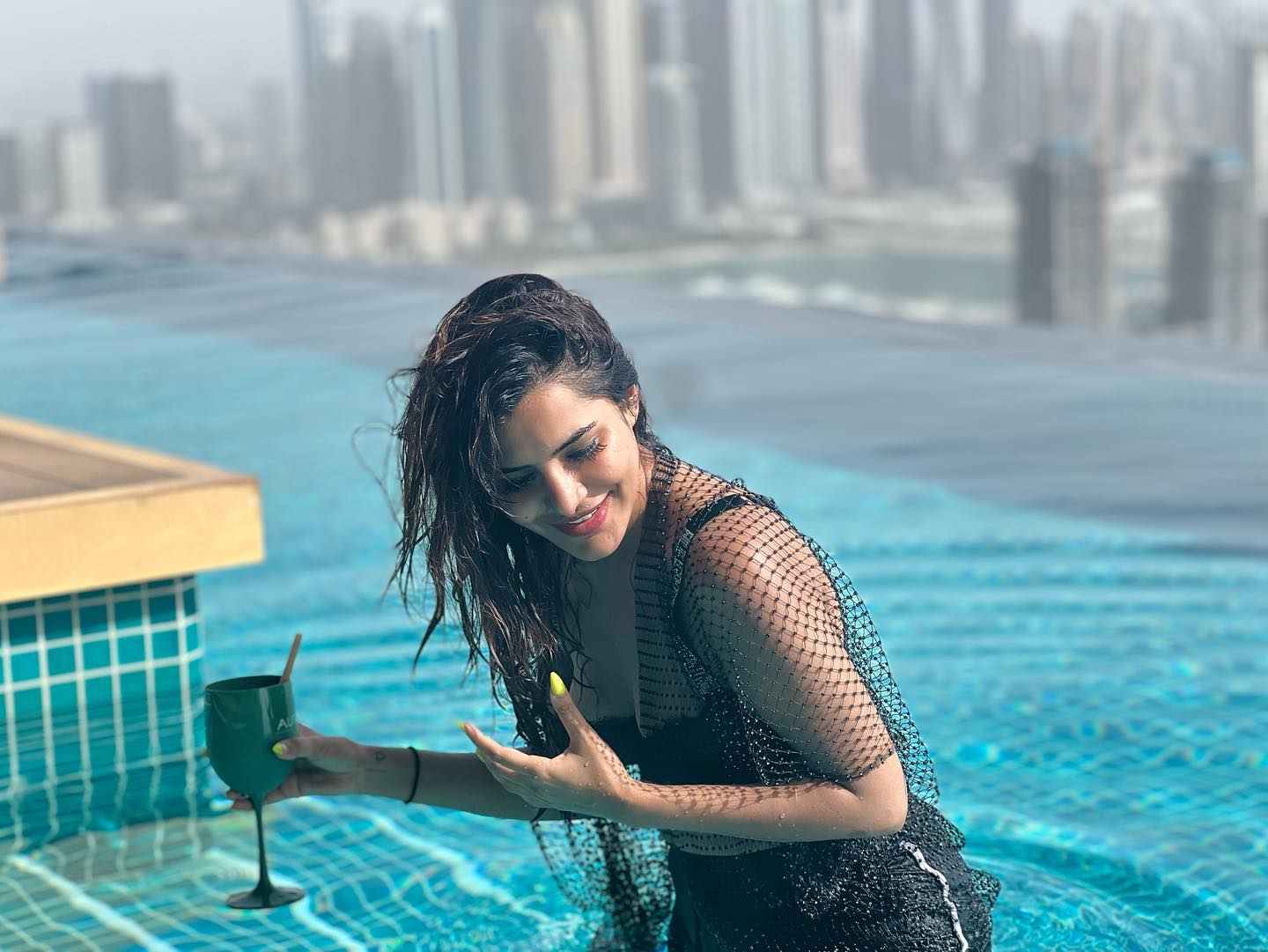 Ashureddy enjoying in swimmingpool at Dubai