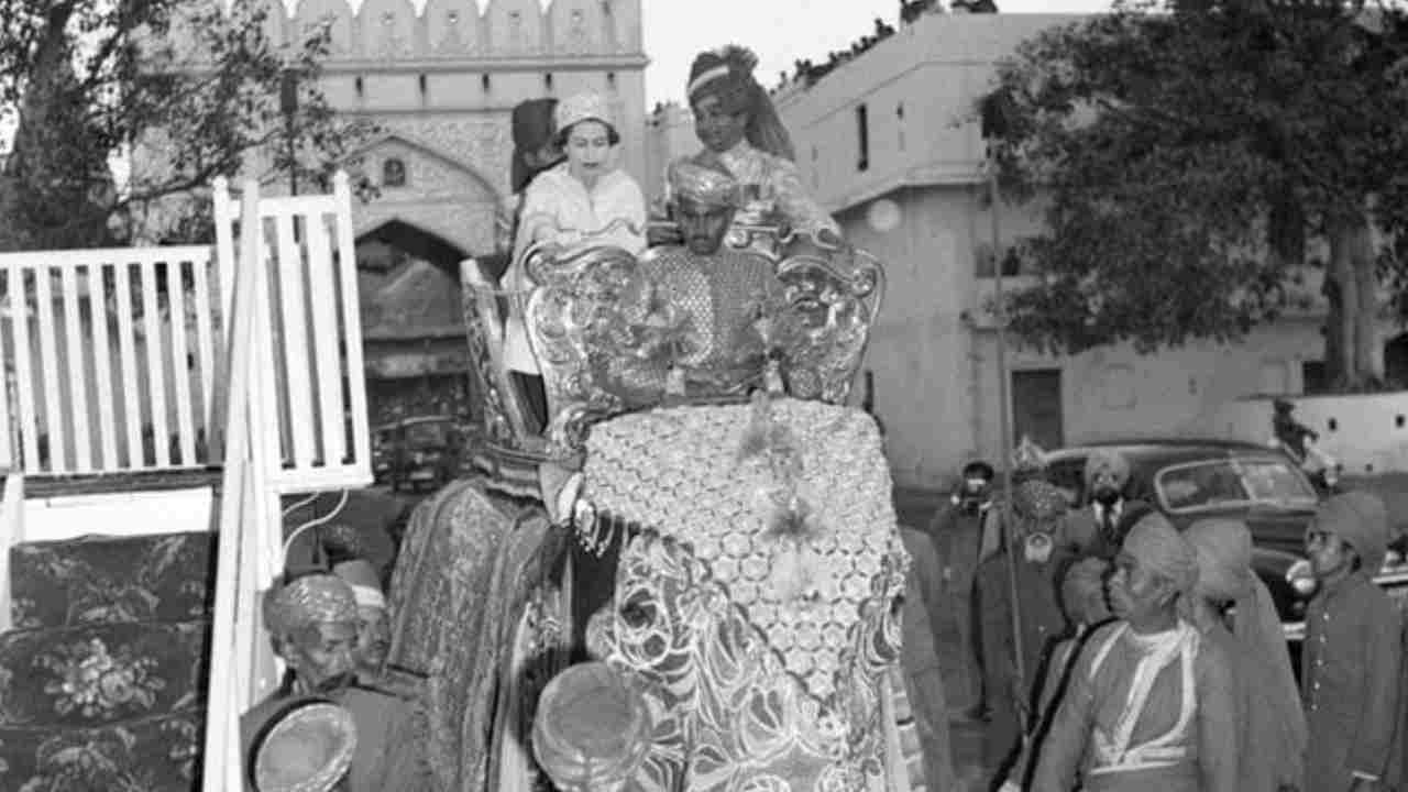 Queen Elizabeth and The Maharaja of Jaipur, Sawai Man Singh II, ride on an elephant on February 6, 1961.