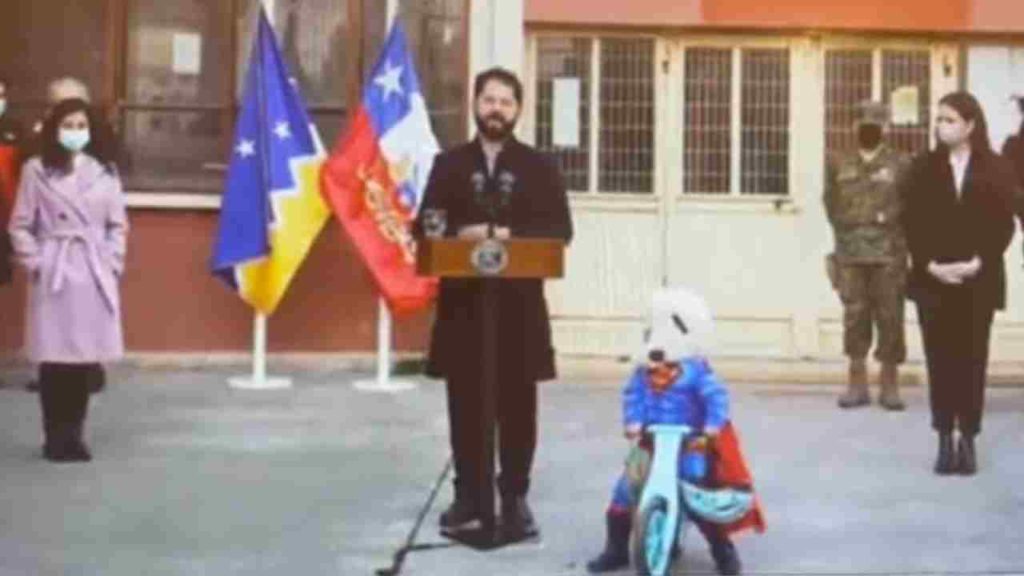 child dressed in superman