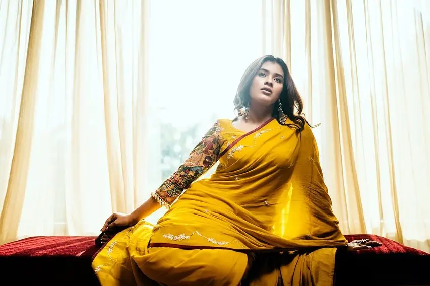 Hebah Patel Poses In Yellow Saree