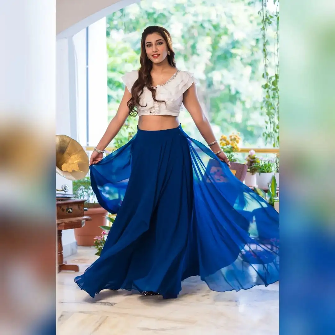 Vishnupriya bloomed in a white & blue dress