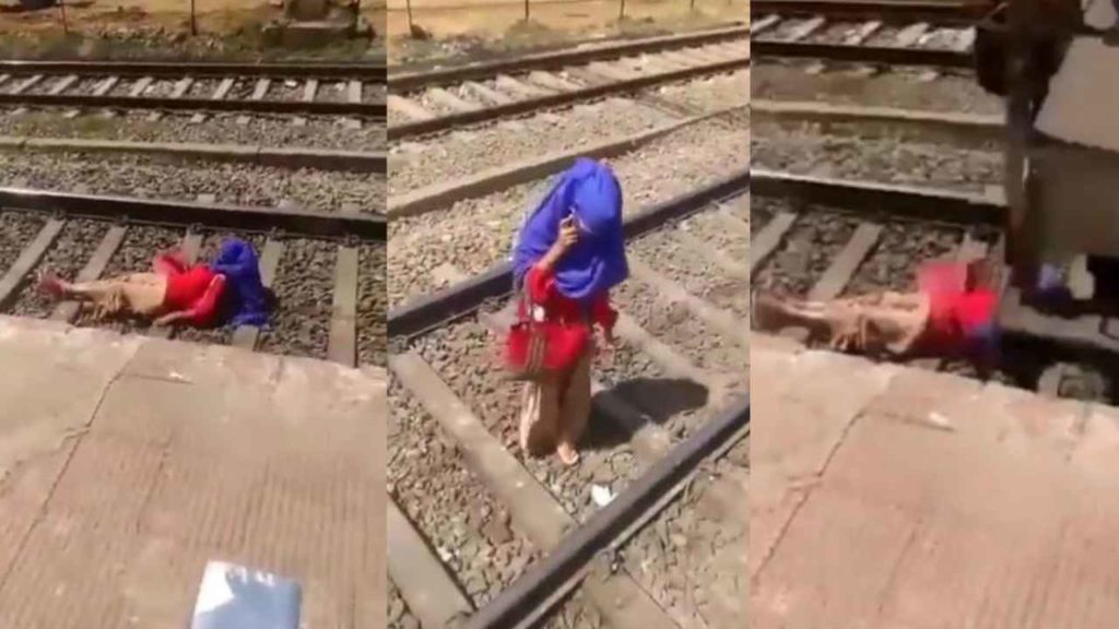 Lady With Phone On Railway Track