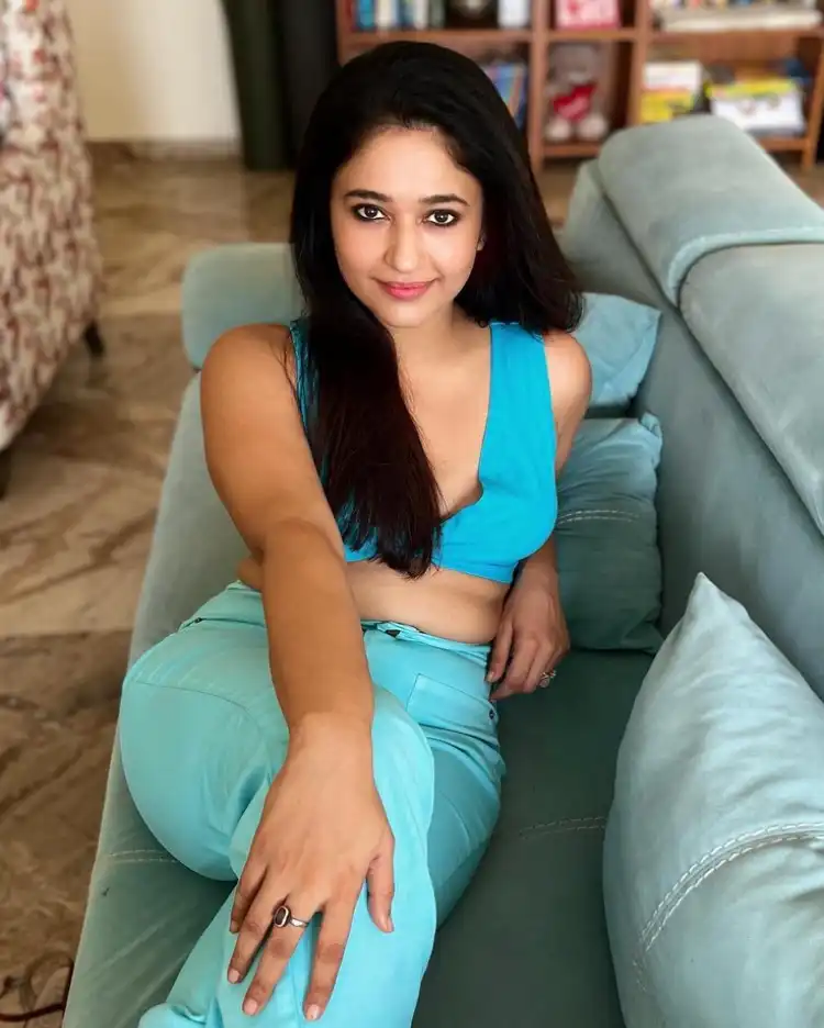 Poonam Bajwa Sizzling Pics In Sofa