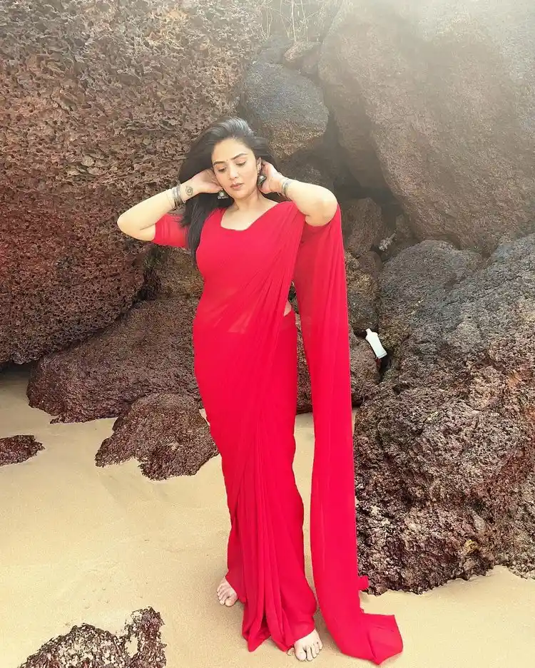 Sreemukhi Sizzles In Red Saree At Beach