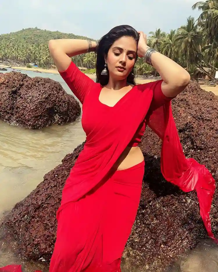 Sreemukhi Sizzles In Red Saree At Beach