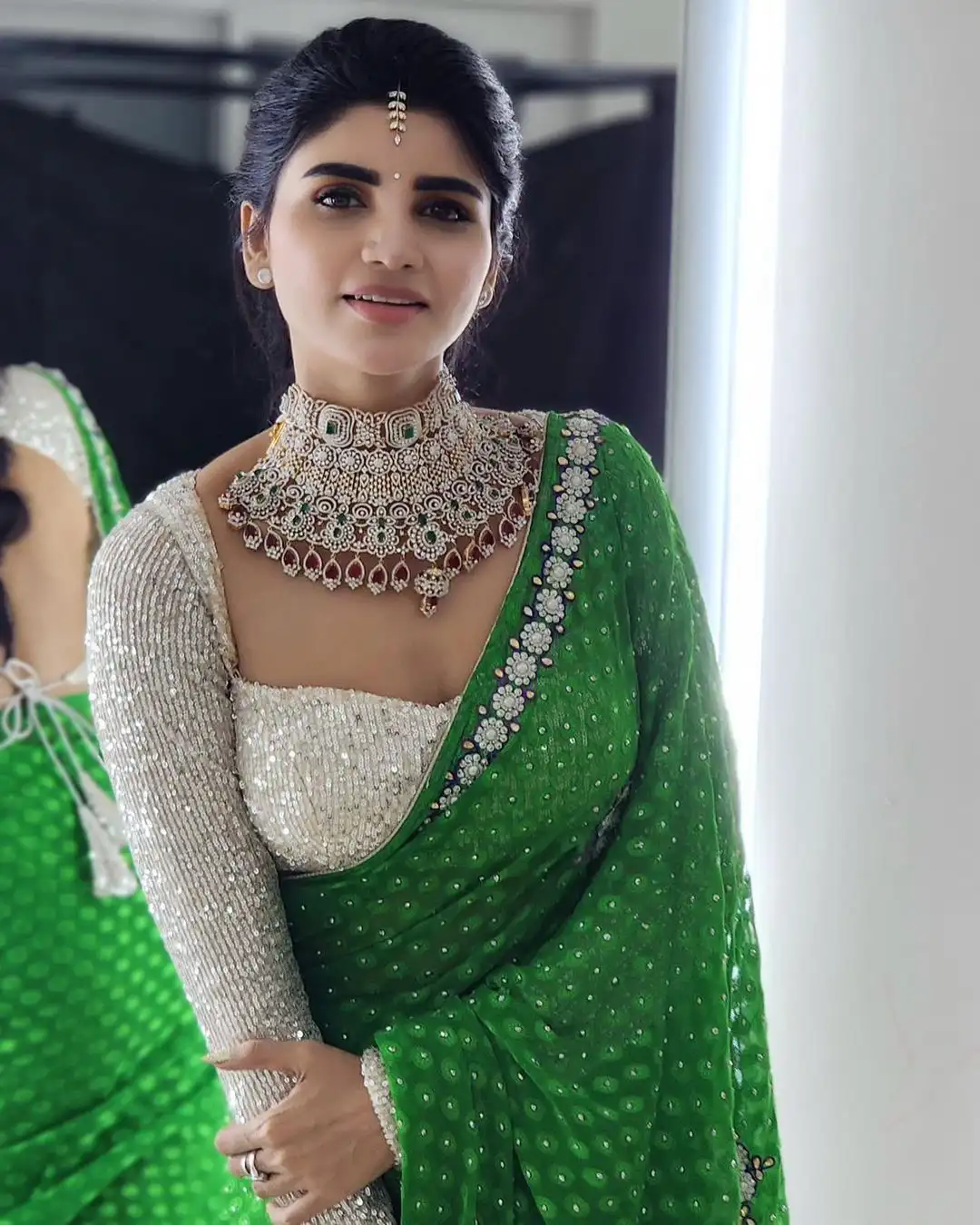 Varsha is sparkling with a necklace around her neck