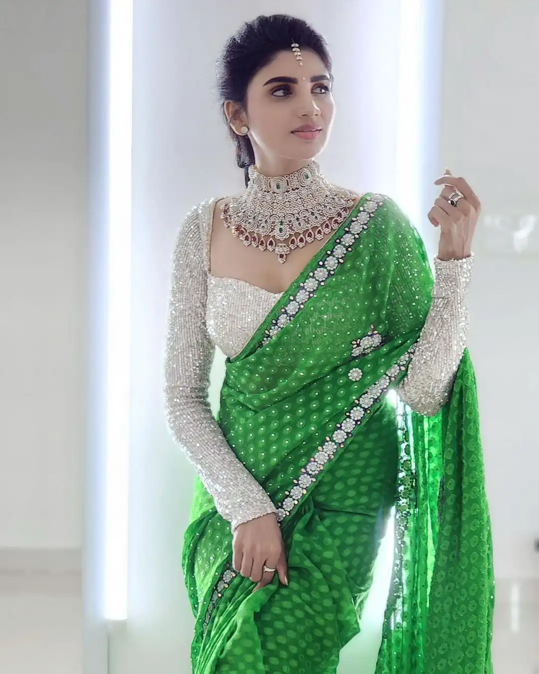 Varsha is sparkling with a necklace around her neck