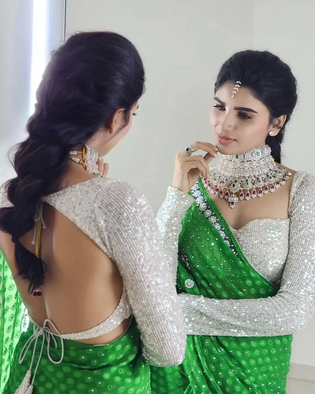 Varsha is sparkling with a necklace around her neck