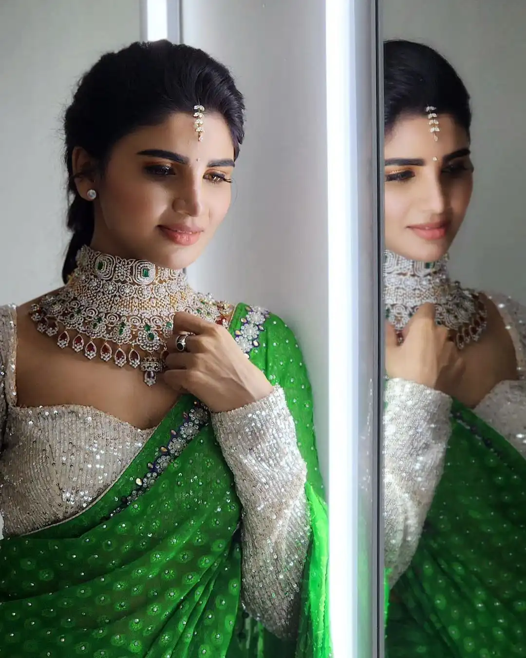 Varsha is sparkling with a necklace around her neck