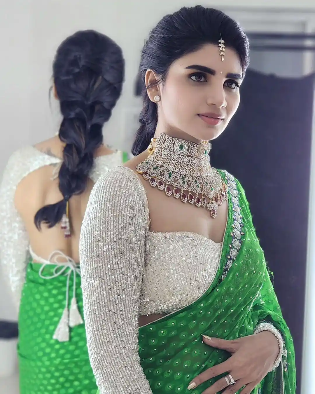 Varsha is sparkling with a necklace around her neck