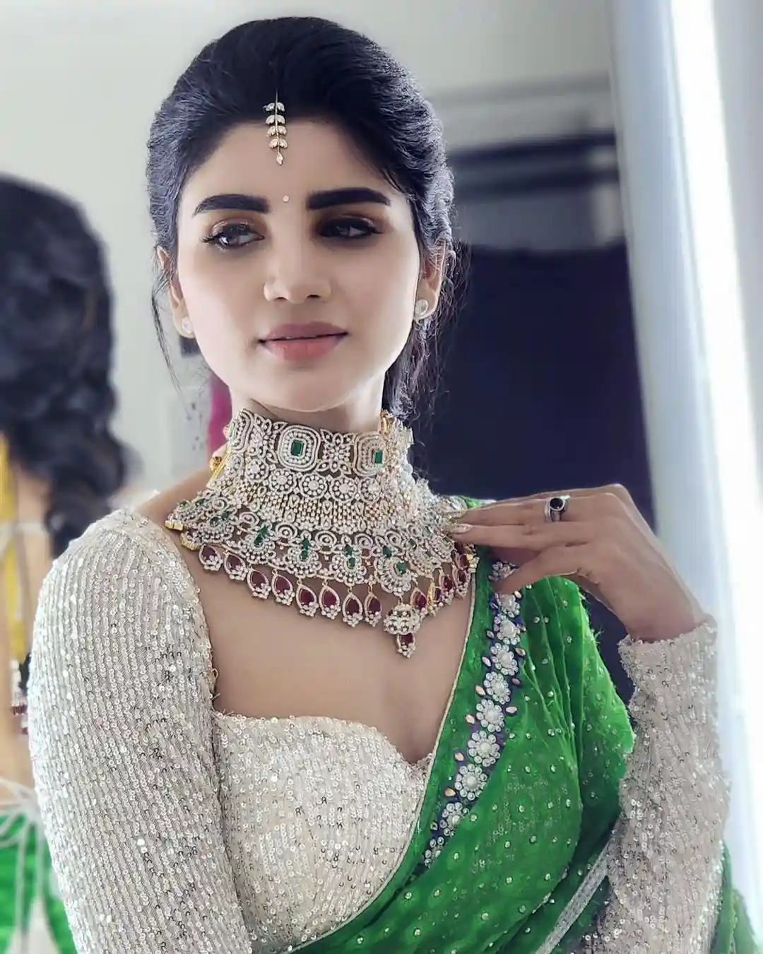 Varsha is sparkling with a necklace around her neck
