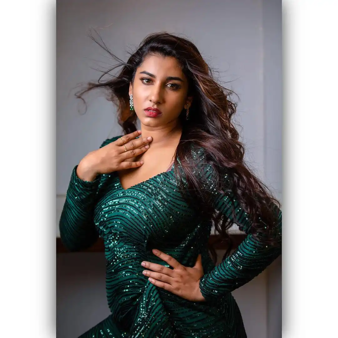 Vishnupriya veraity Poses in Short Green Dress