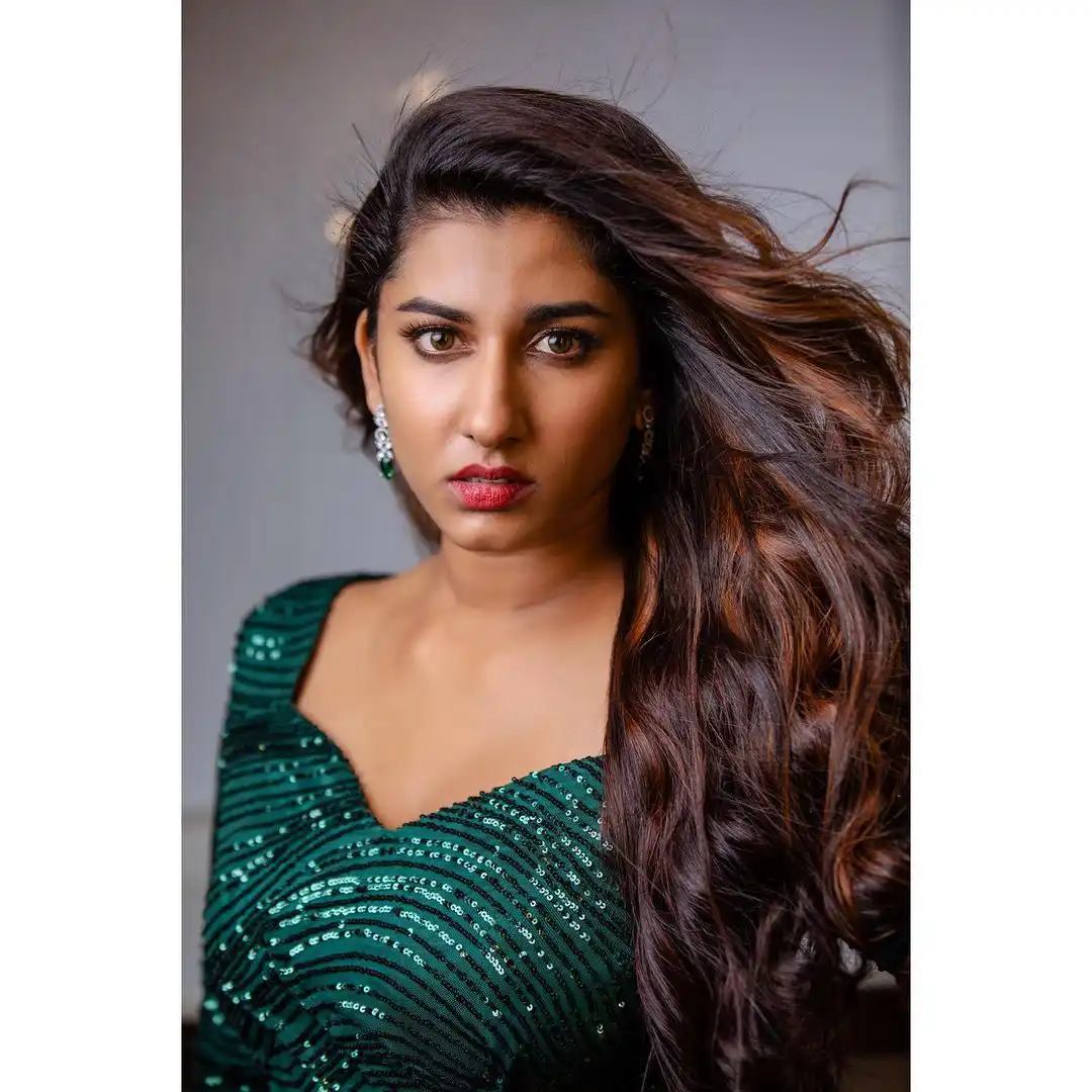 Vishnupriya veraity Poses in Short Green Dress
