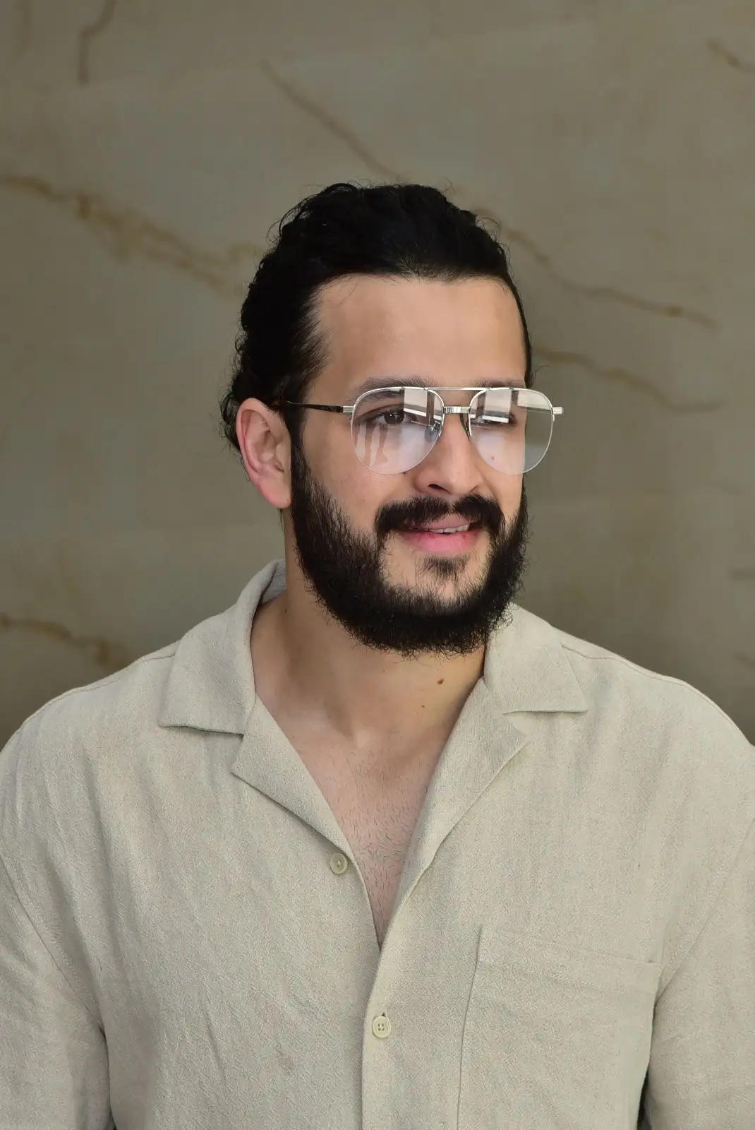 Akhil Akkineni stylish looks in agent movie promotions