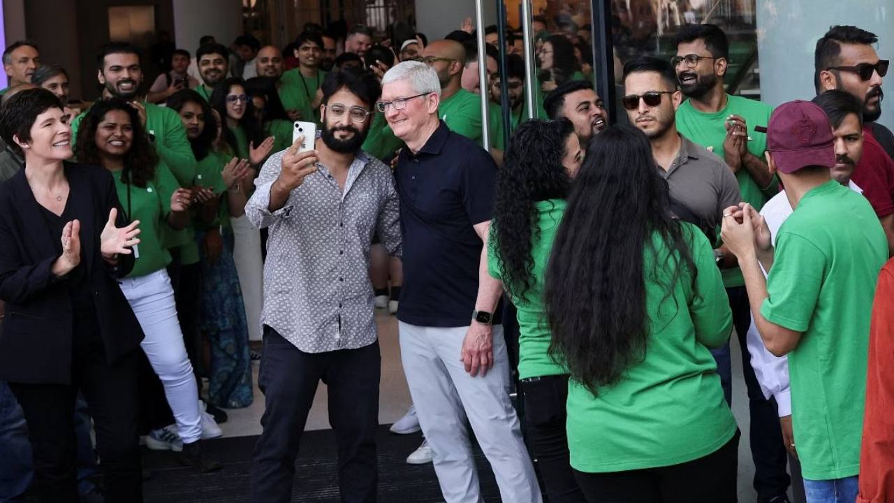 Apple fans touch CEO Tim Cook's feet at Delhi store, line up to get his autograph