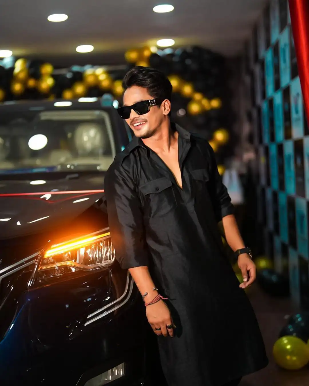 Mehaboob Dil Se poses with his new car