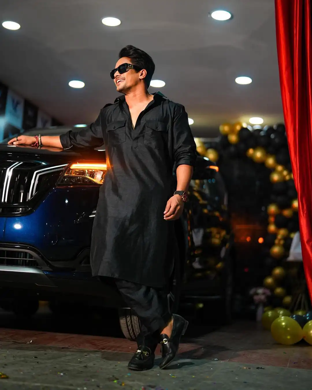 Mehaboob Dil Se poses with his new car