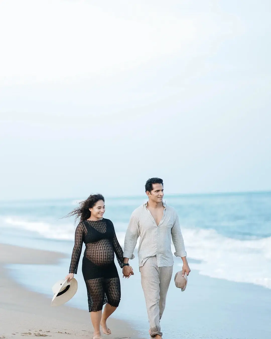 Actress Pooja Ramachandran Baby Bump Photo Shoot with Husband at Beach 