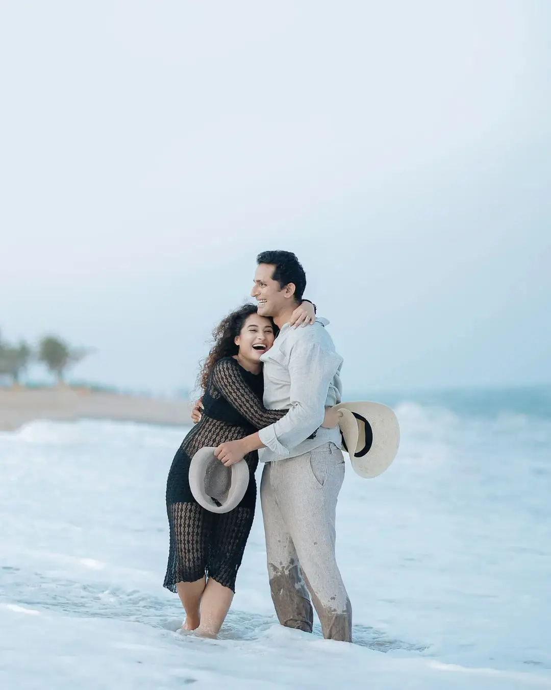 Actress Pooja Ramachandran Baby Bump Photo Shoot with Husband at Beach 