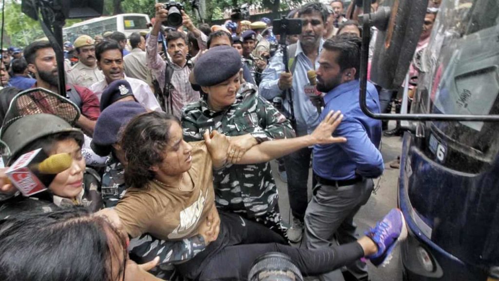 Police Arrest Wrestlers