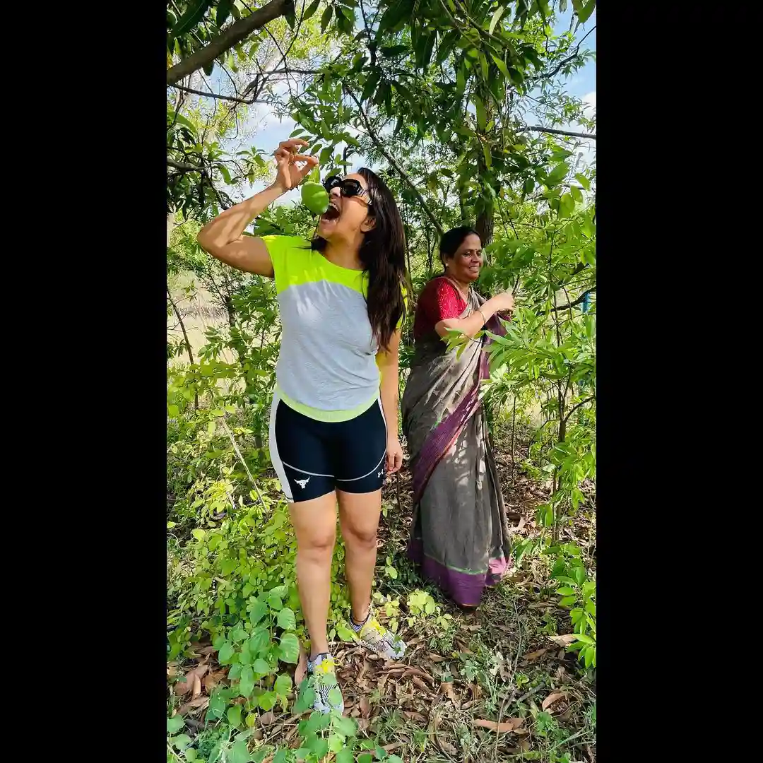 Tollywood Actress Anasuya enjoying at mango farm with her husband