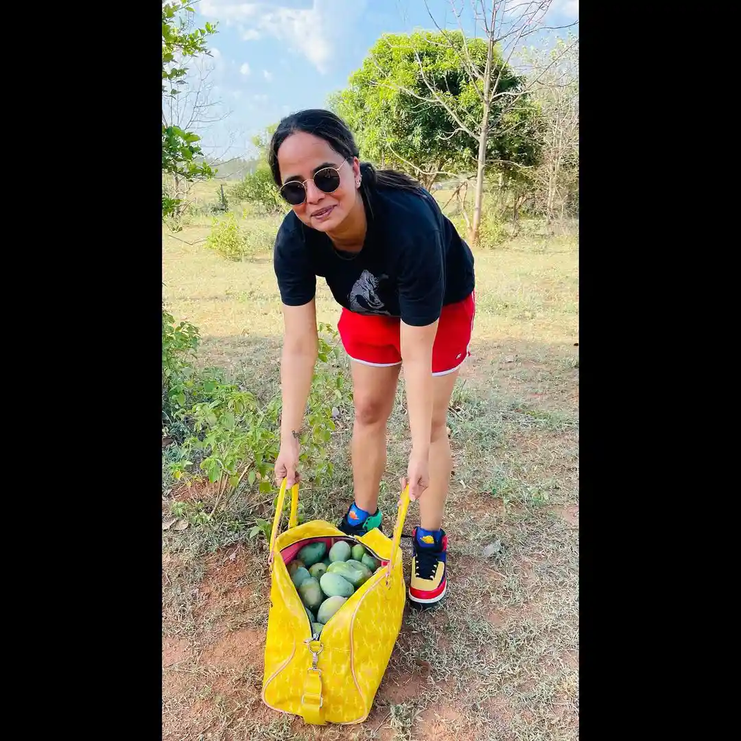 Tollywood Actress Anasuya enjoying at mango farm with her husband