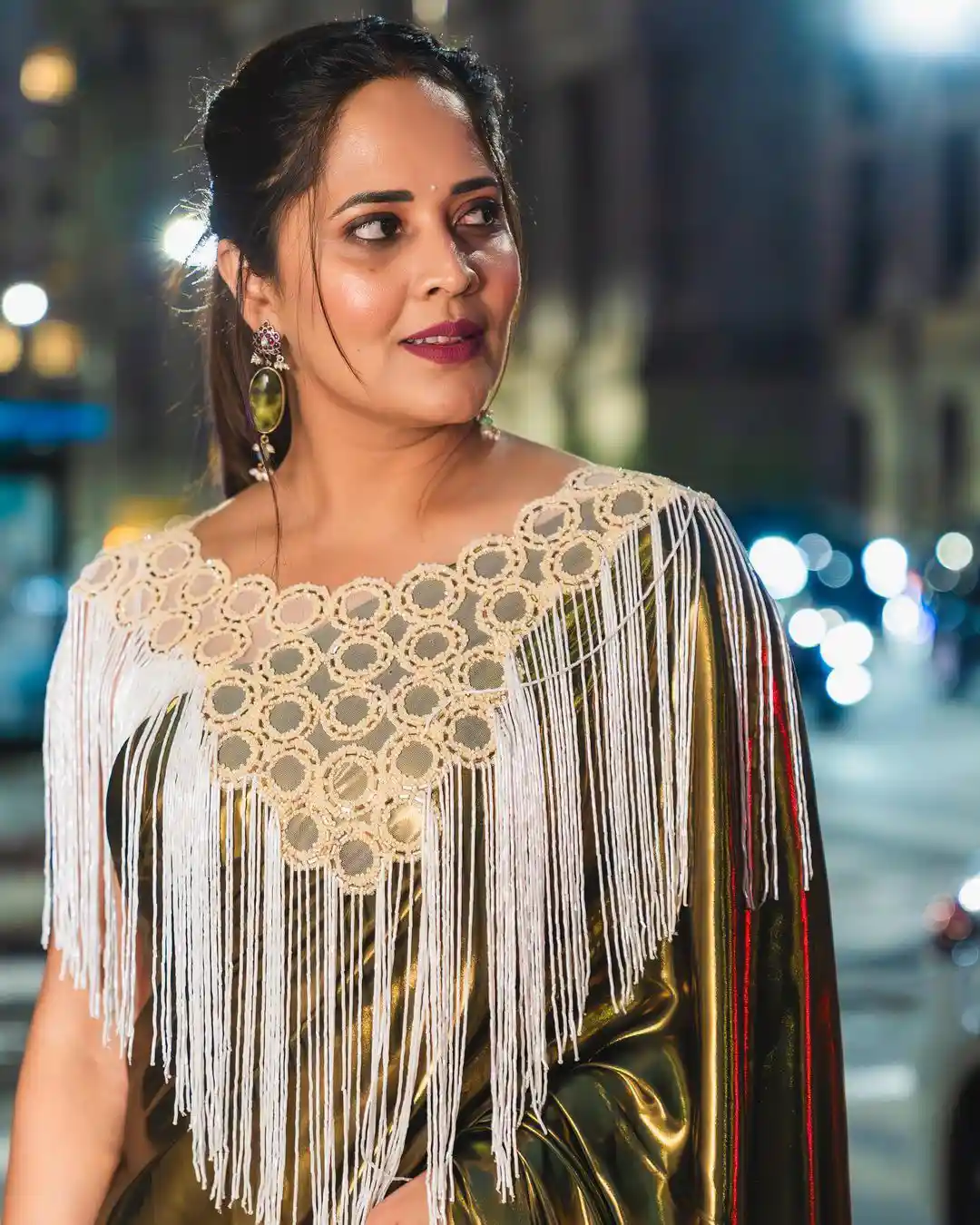 Anchor Anasuya Shines in Golden Saree at America