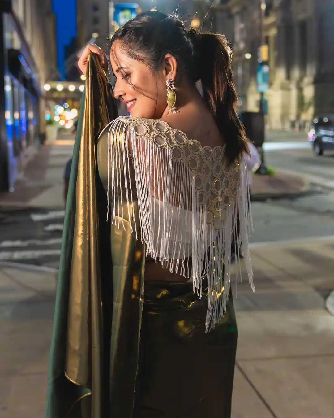 Anchor Anasuya Shines in Golden Saree at America