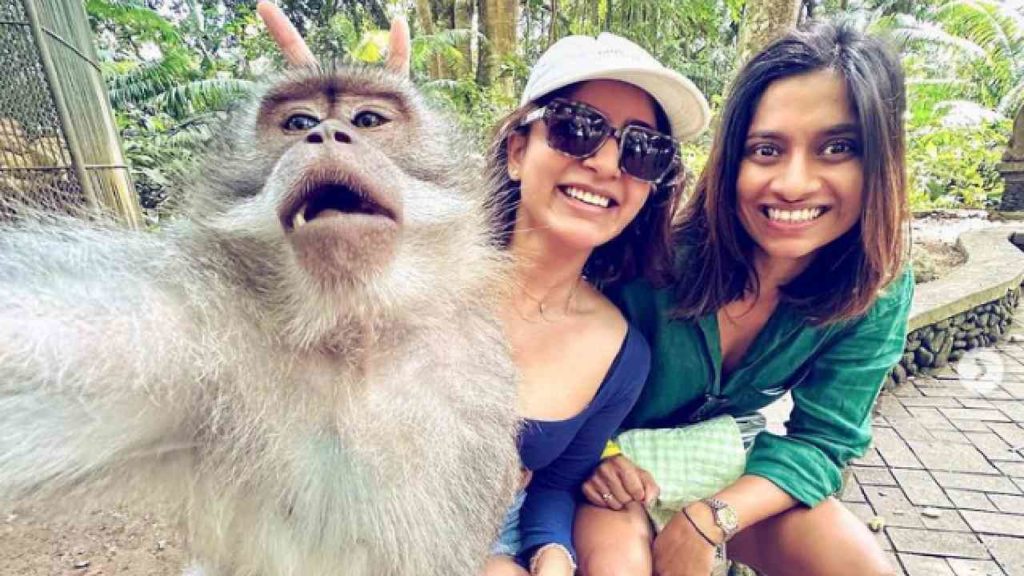 Samantha selfie with monkey in indonesia Bali